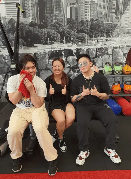 Three Glutrition clients resting on a bench after a session